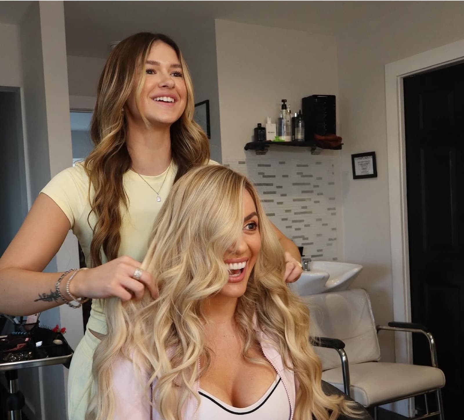 Bloom Salon ATX stylist consulting with a client about extensions